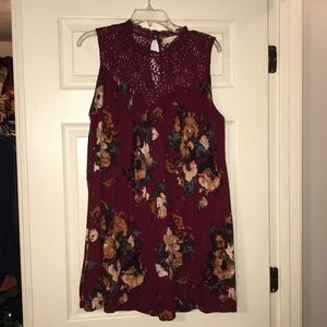 Altard State top. Wine with floral design.